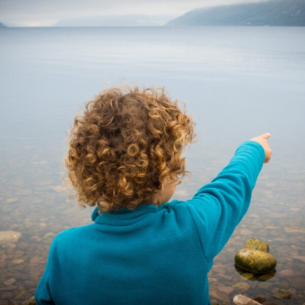 Child pointing towards Loch Ness