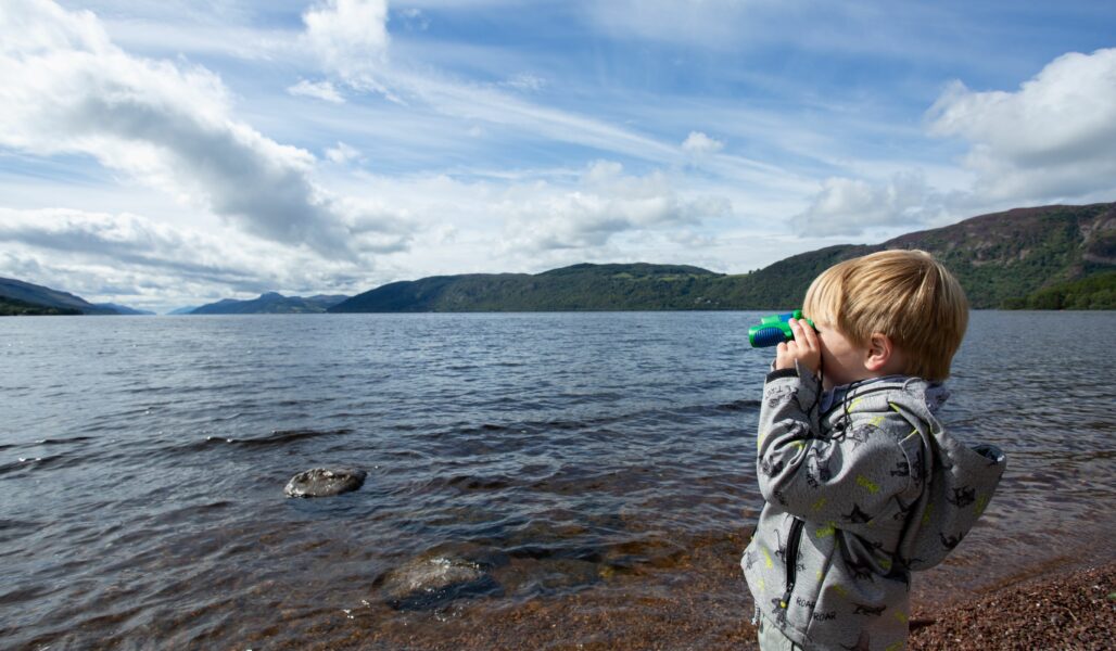 A boy looking for Nessie during The Quest