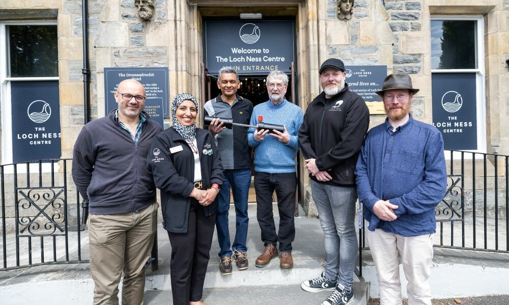 Nagina, General Manager at The Loch Ness Centre, Alan Mckenna from Loch Ness Exploration, Aberdeen Univerity School of Engineering outside the centre with weeHoloCam