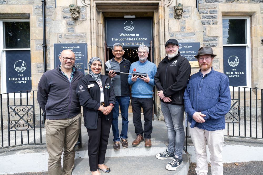 Nagina, General Manager at The Loch Ness Centre, Alan Mckenna from Loch Ness Exploration, Aberdeen Univerity School of Engineering outside the centre with weeHoloCam