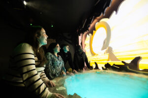 A group at The Loch Ness Centre learning about Highland myths and legends