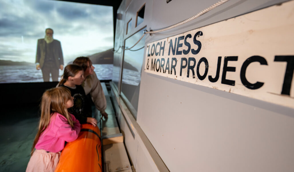 Mother and 2 daughters looking at the John Murray Vessel