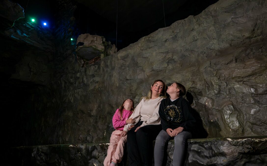 Family looking at The Pequod in The Loch Ness Centre