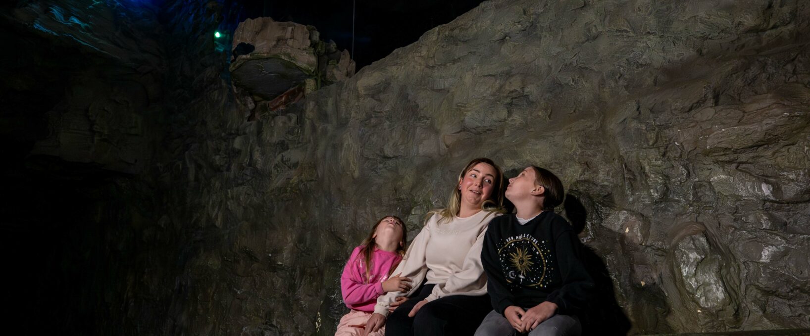 Family looking at The Pequod in The Loch Ness Centre