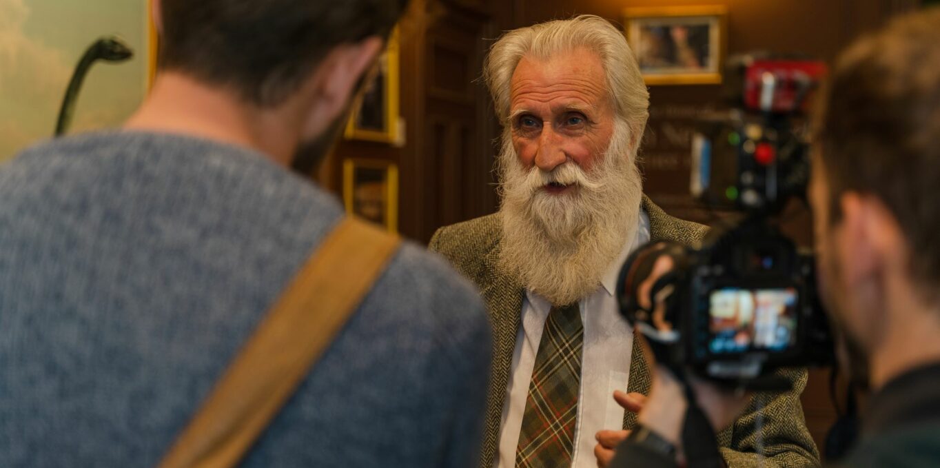 Adrian Shine in The Loch Ness Centre talking to the press