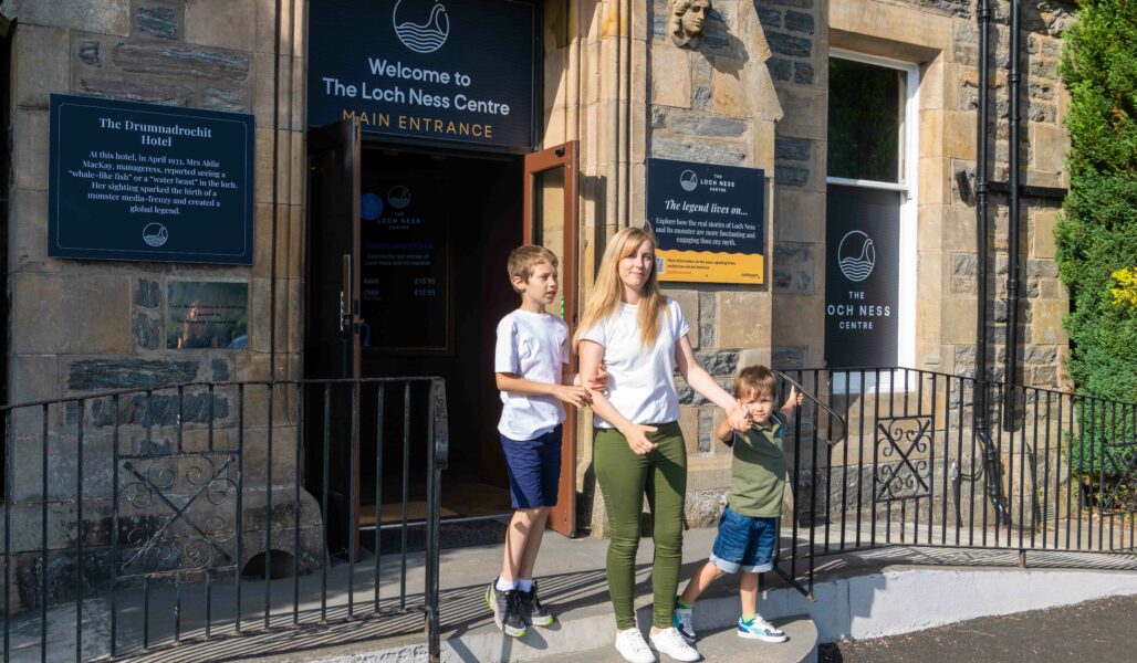 A family outside The Loch Ness Centre