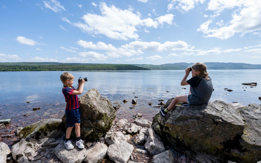 Kids looking for Nessie at Loch Ness during The Quest