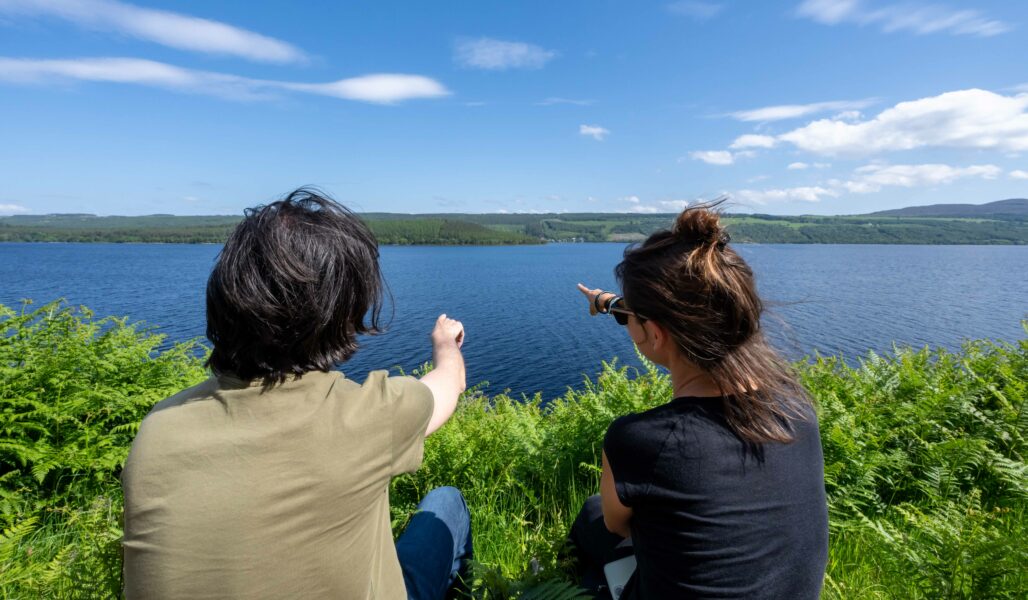 Couple Nessie Hunting on Loch Ness during The Quest Weekend
