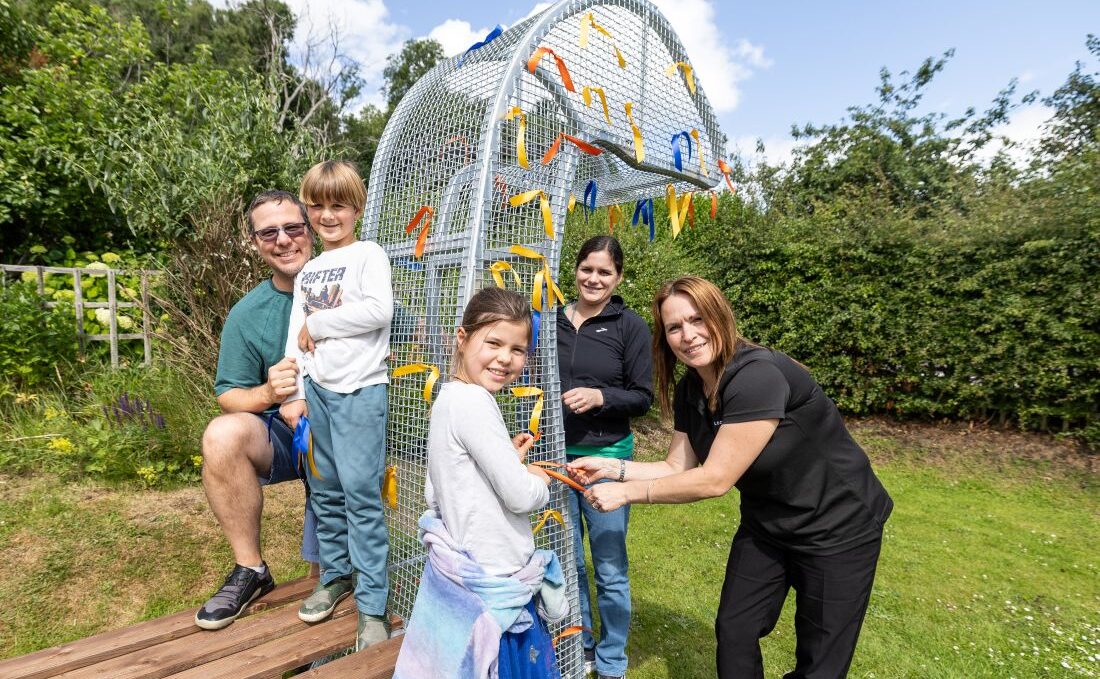 Family adding the voice to the statue of the Loch Ness Monster